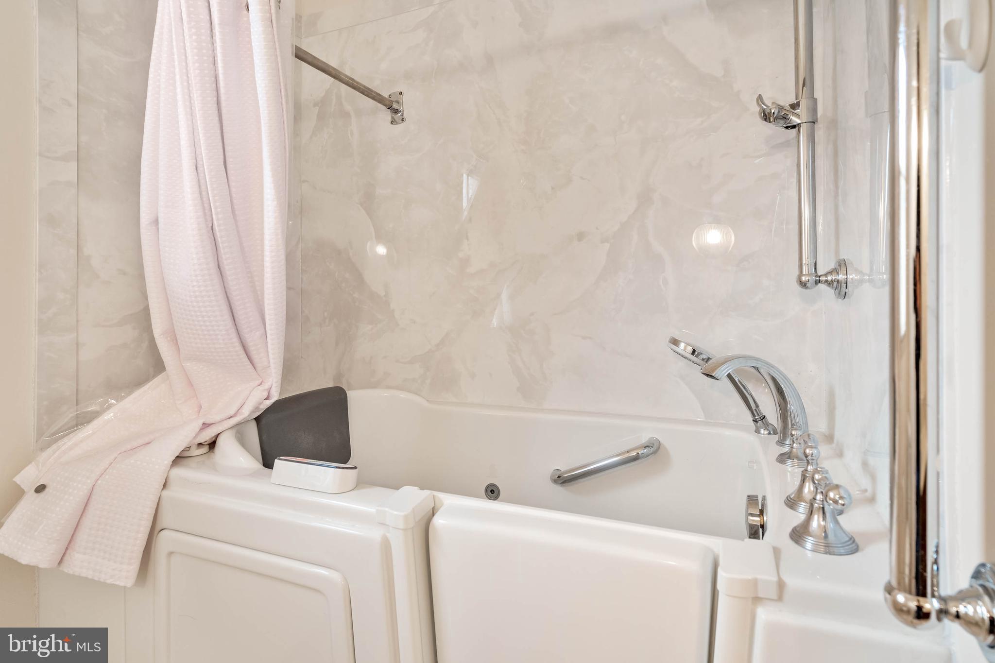 27 Devries Circle Lewes, DE 19958 - Photo 18 of 40 a bathroom with a sink and a shower curtain