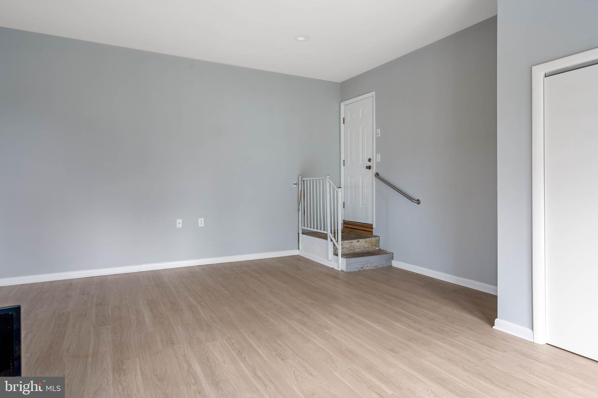 27 Devries Circle Lewes, DE 19958 - Photo 27 of 40 a view of an empty room with wooden floor