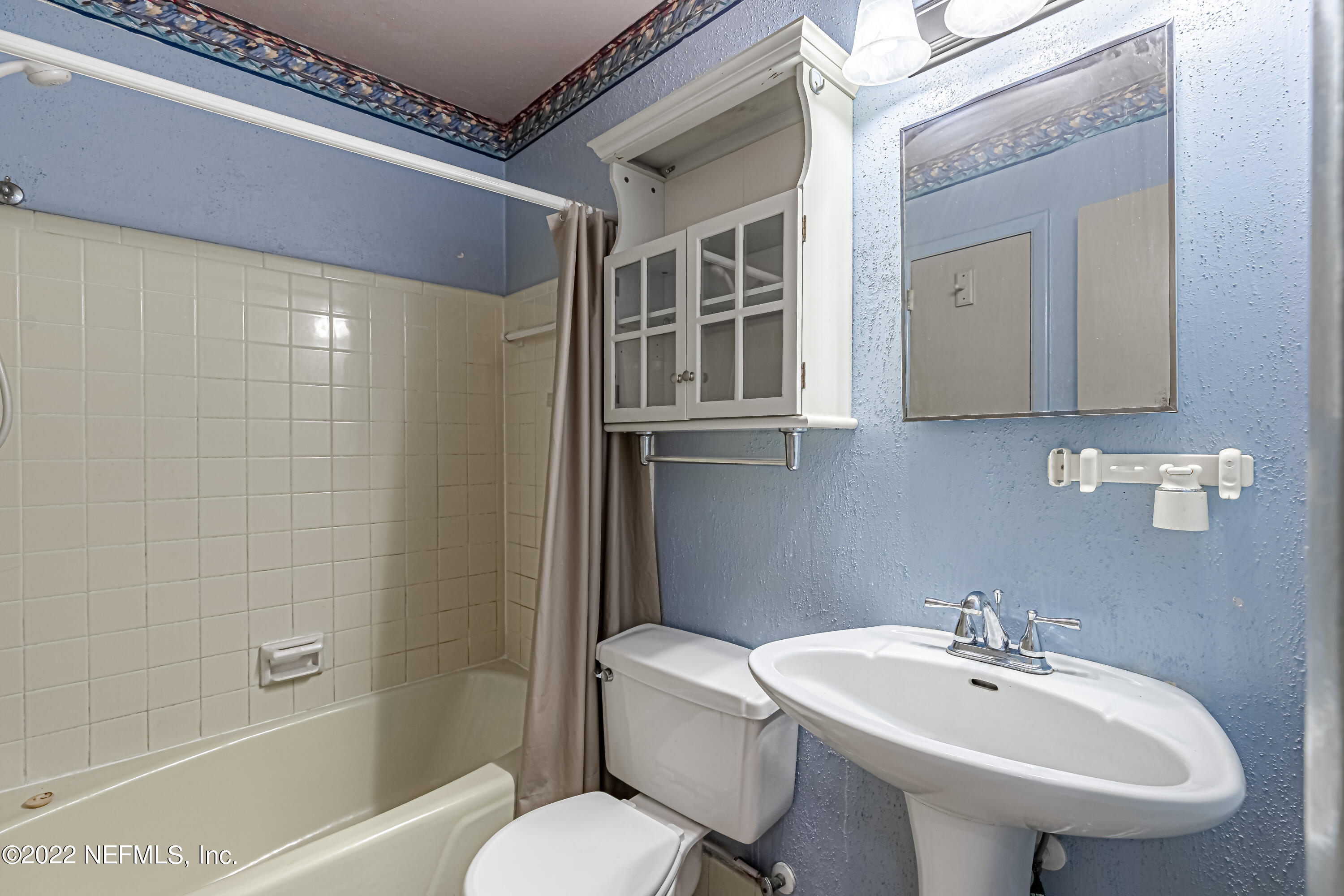 7204 Old Kings Road South Jacksonville, FL 32217 - Photo 17 of 32 a bathroom with a sink a toilet and shower