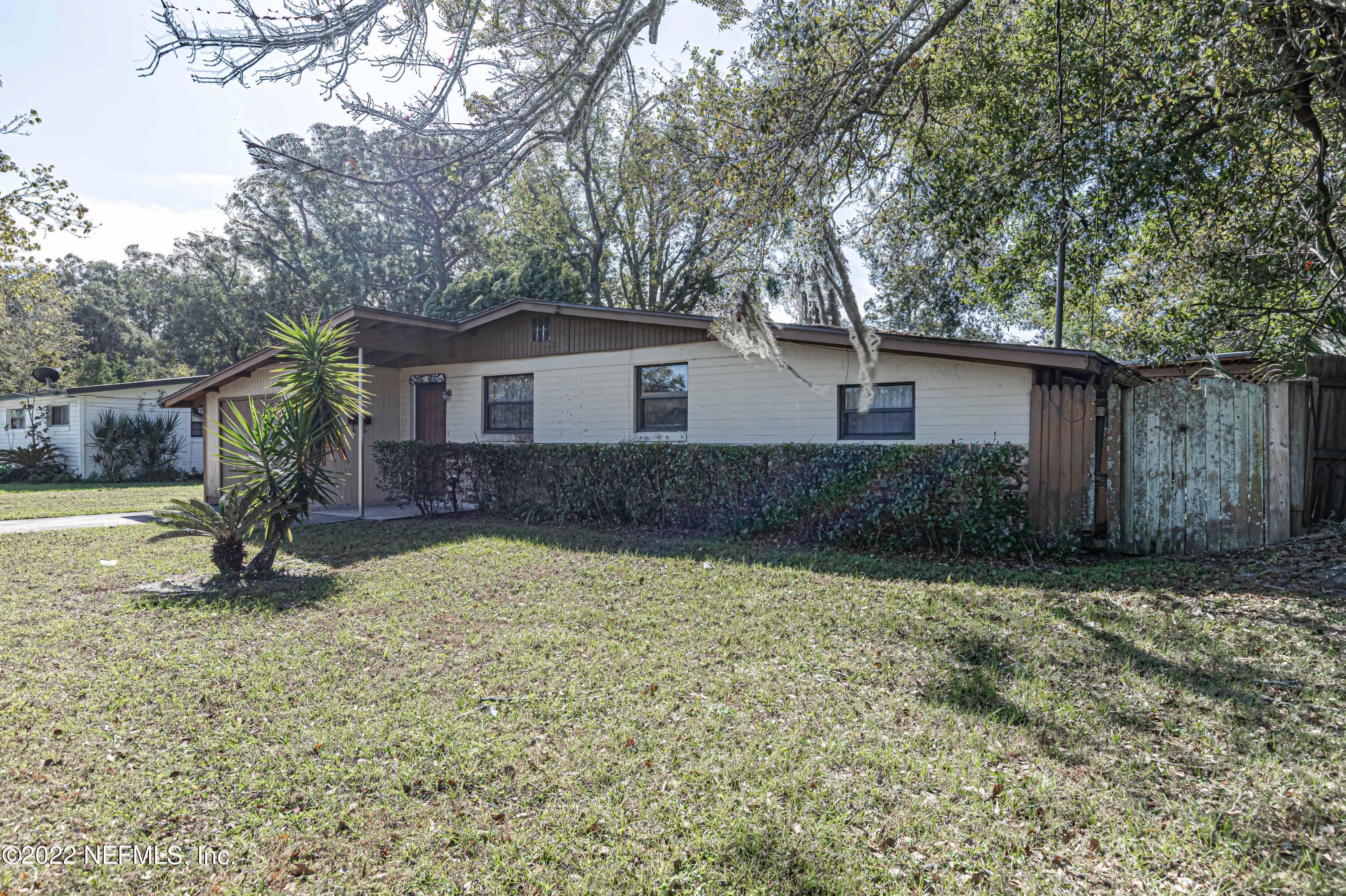 7204 Old Kings Road South Jacksonville, FL 32217 - Photo 2 of 32 a house with a tree in front of it