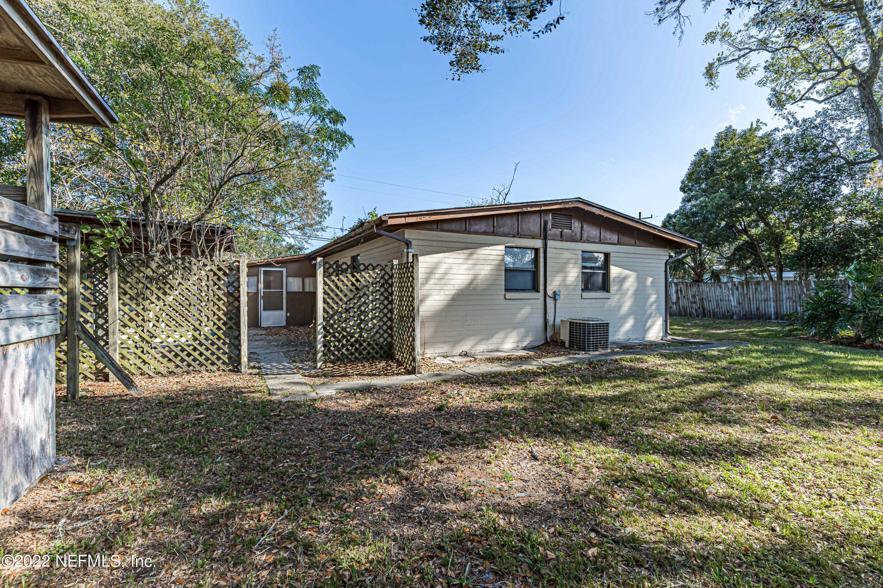 7204 Old Kings Road South Jacksonville, FL 32217 - Photo 28 of 32 a big house with a big yard and large trees