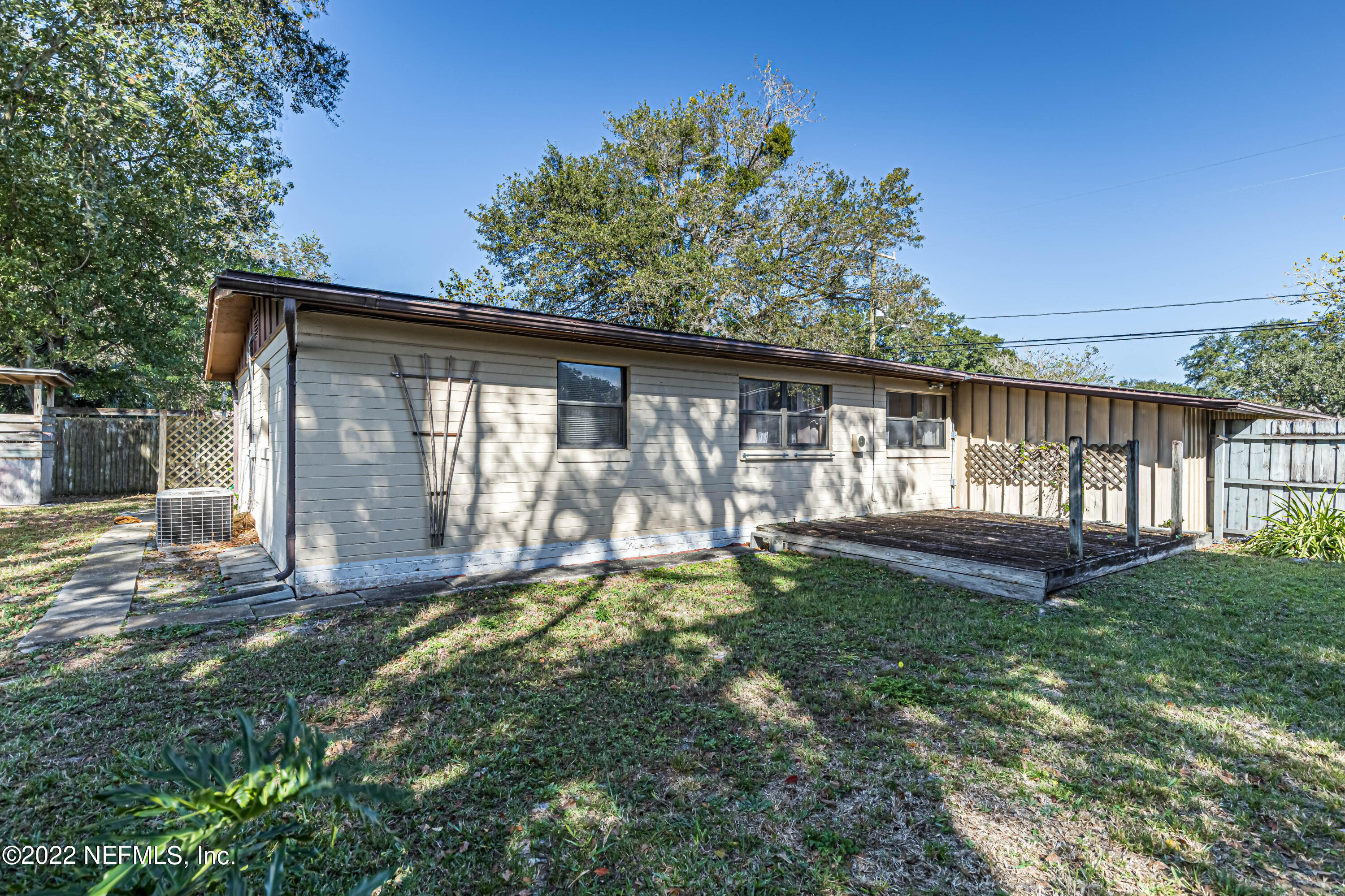 7204 Old Kings Road South Jacksonville, FL 32217 - Photo 31 of 32 a view of a house with backyard and sitting area