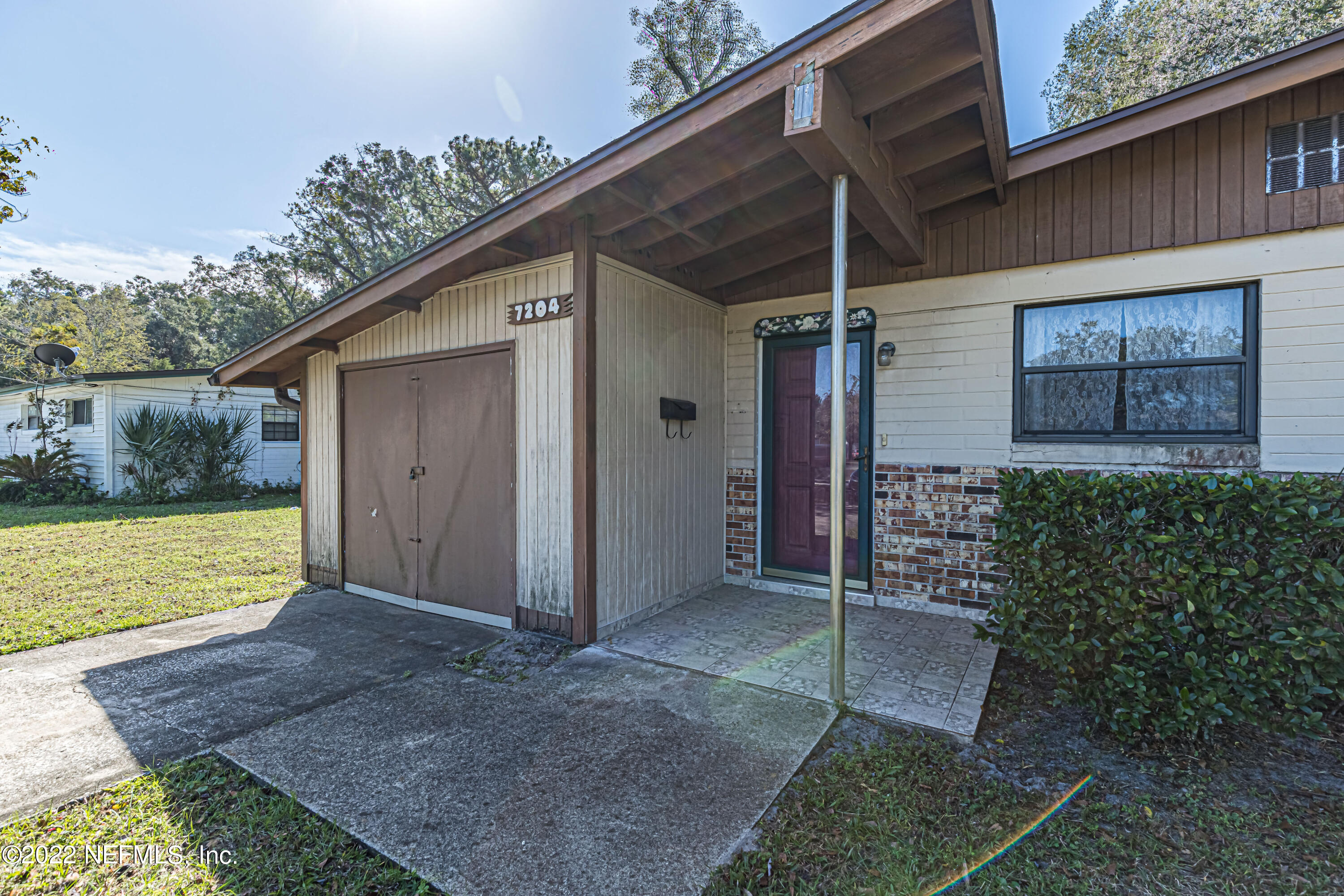 7204 Old Kings Road South Jacksonville, FL 32217 - Photo 4 of 32 a view of a house with a yard