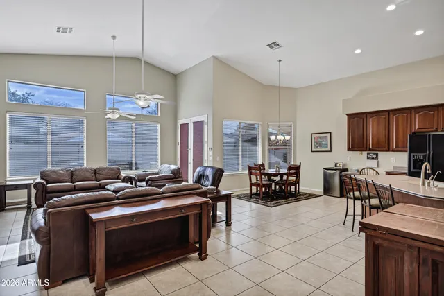 a kitchen with stainless steel appliances a stove a sink and a refrigerator
