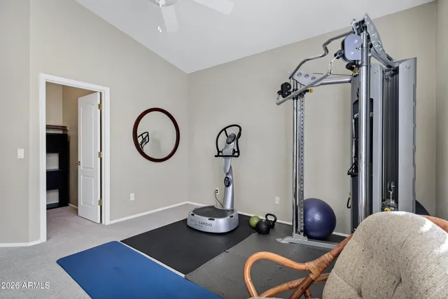 a view of a dining room with furniture and a chandelier