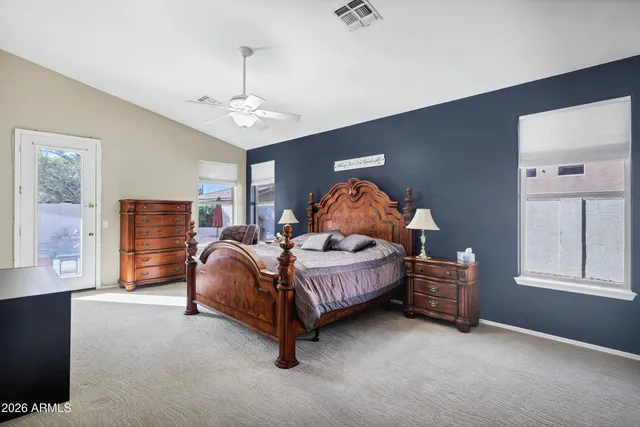 a bed room with a bed and a window