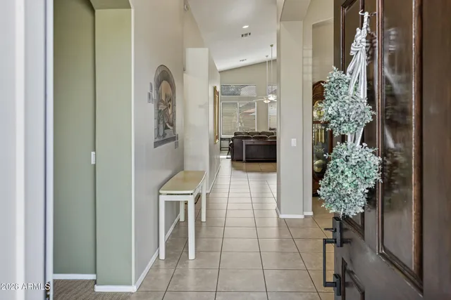 a lobby with furniture and a potted plant