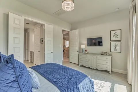 a living room with furniture and a book shelf