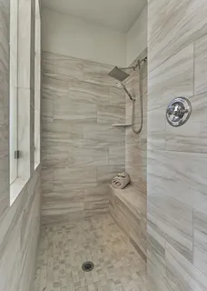 a bathroom with a tub a sink and a mirror