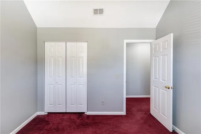 an empty room with wooden floor