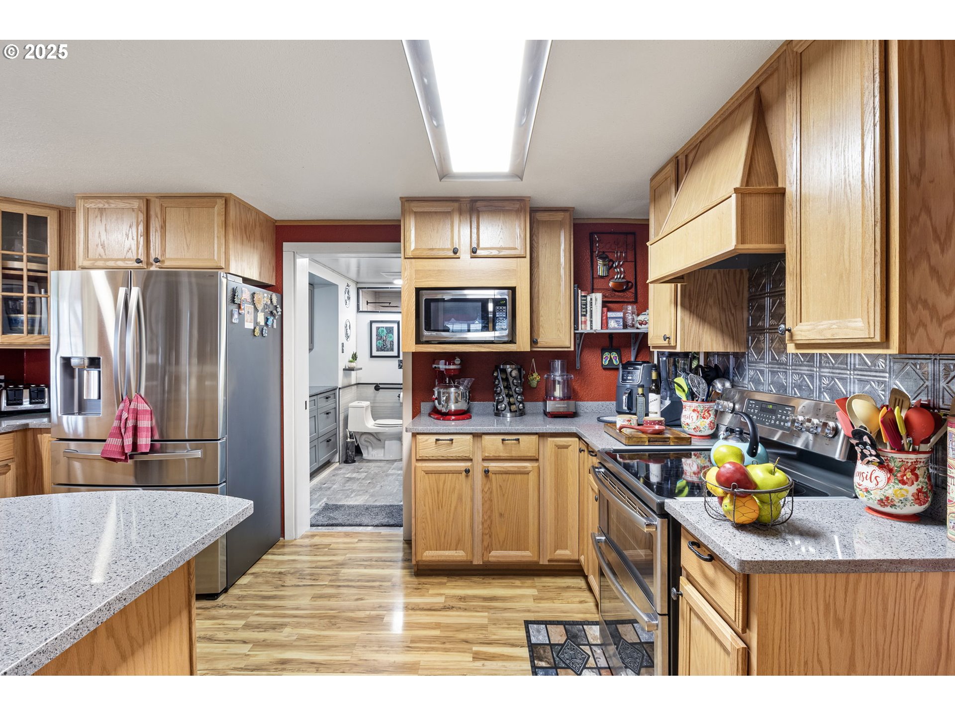 252 Alder Street Yoncalla, OR 97499 - Photo 20 of 47 a kitchen with stainless steel appliances granite countertop a sink refrigerator and cabinets