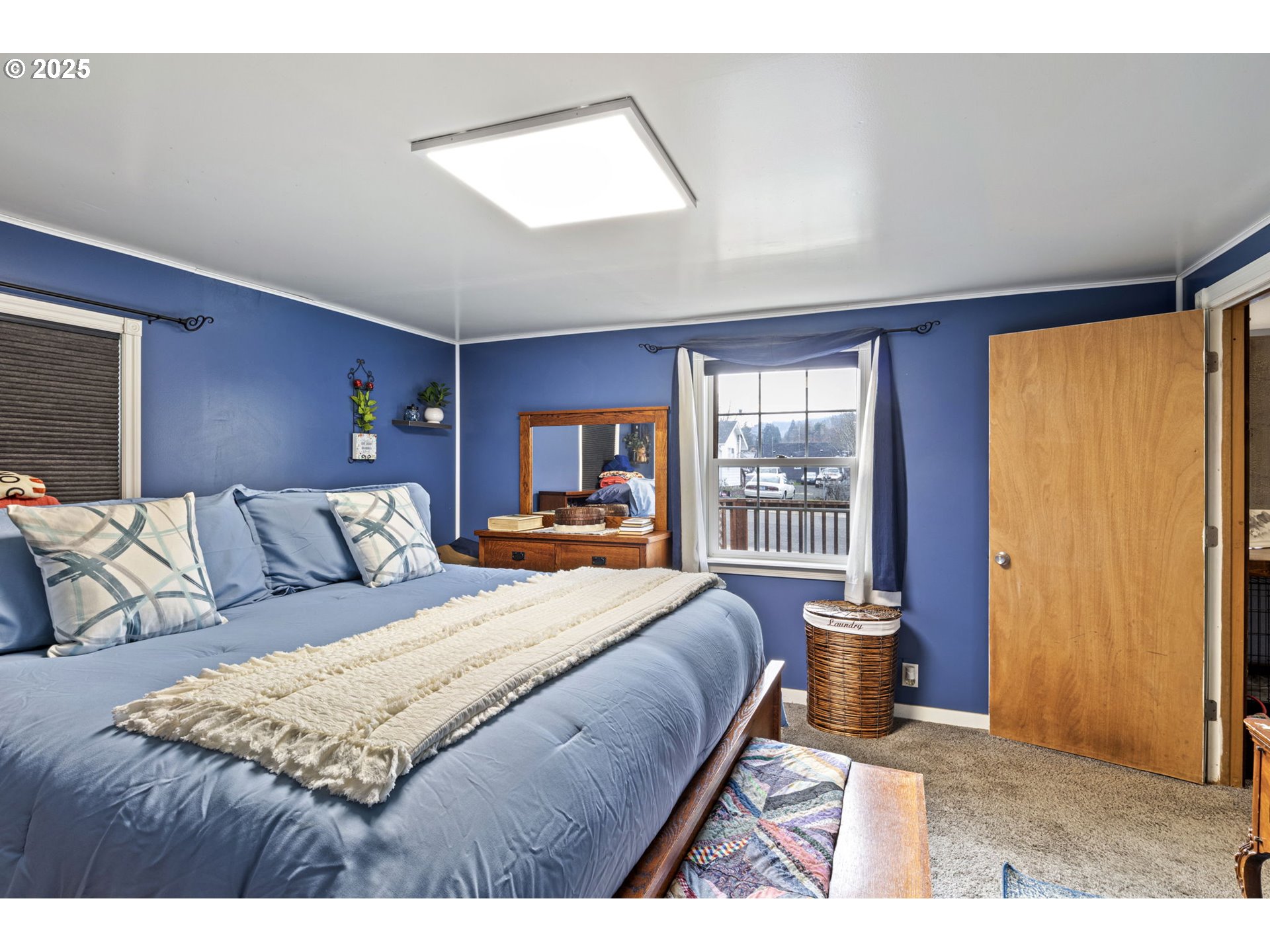 252 Alder Street Yoncalla, OR 97499 - Photo 30 of 47 a bed sitting in a bedroom next to a window