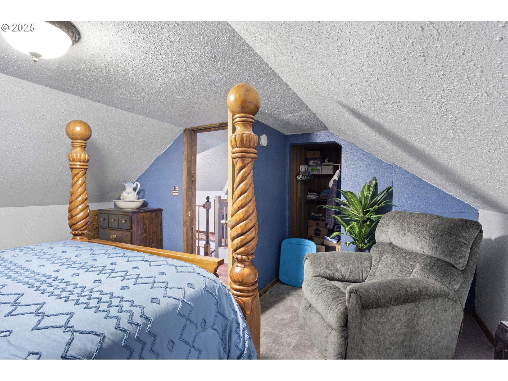 252 Alder Street Yoncalla, OR 97499 - Photo 35 of 47 a bedroom with a bed and a potted plant