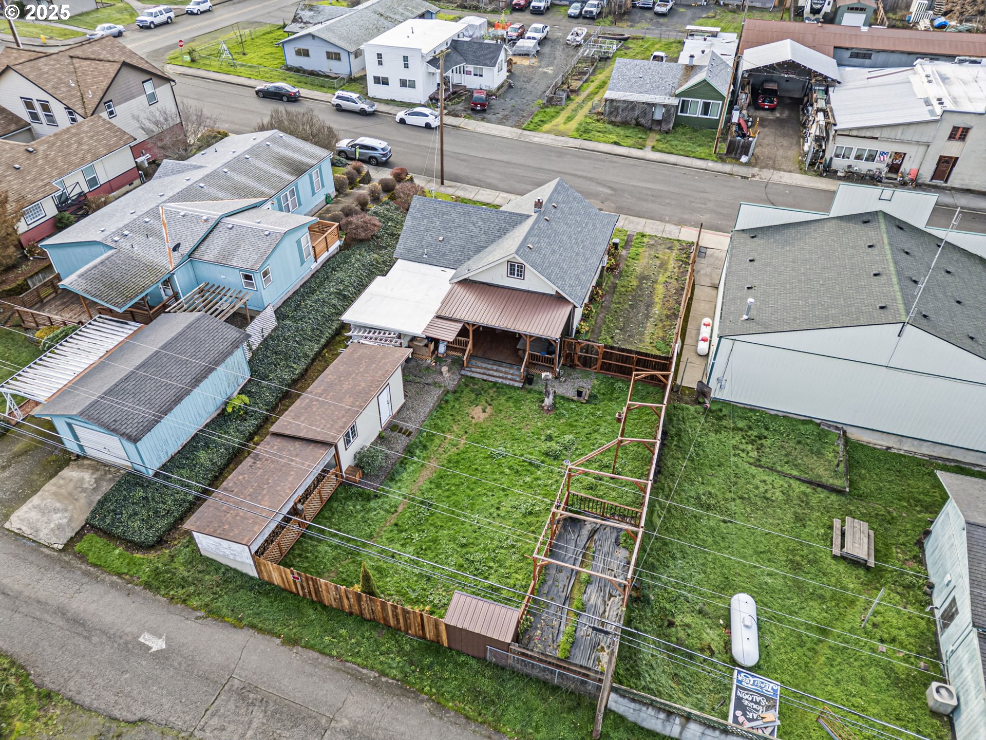 252 Alder Street Yoncalla, OR 97499 - Photo 46 of 47 an aerial view of a house with garden space and street view