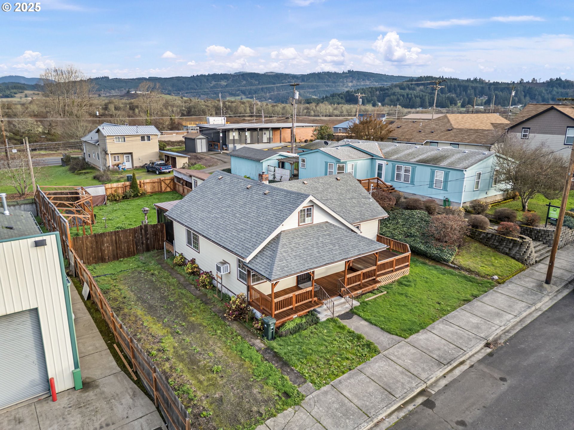 252 Alder Street Yoncalla, OR 97499 - Photo 8 of 47 an aerial view of multiple houses with a yard