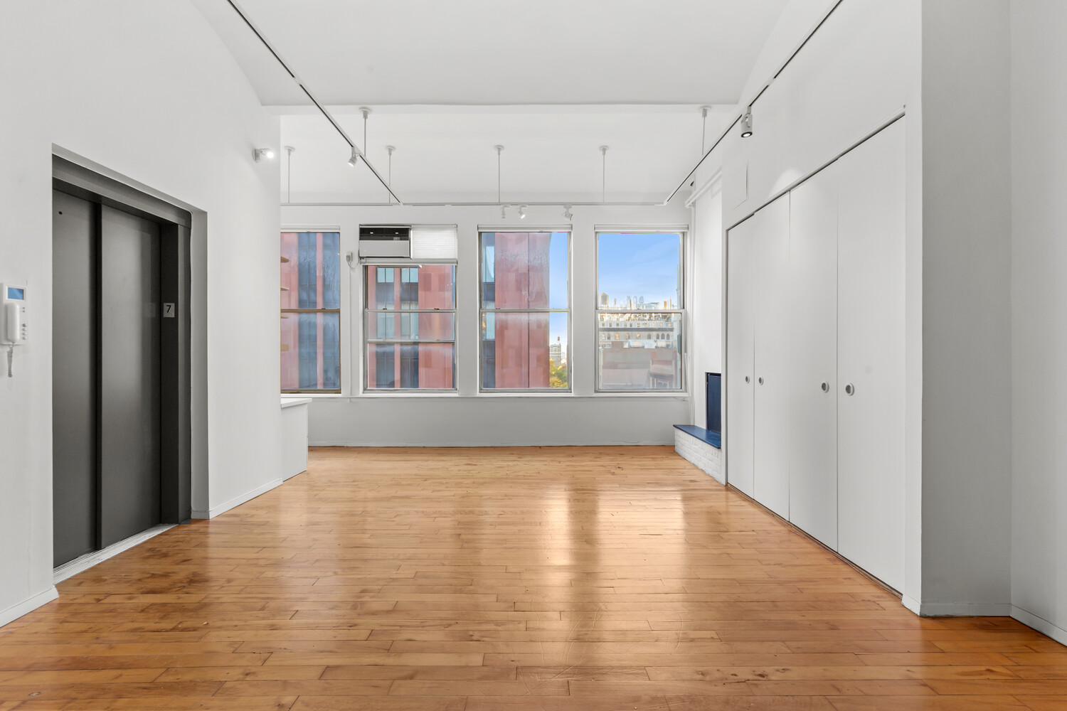 712 Broadway, Unit 7 Manhattan, NY 10003 - Photo 2 of 14 a view of an empty room with glass door