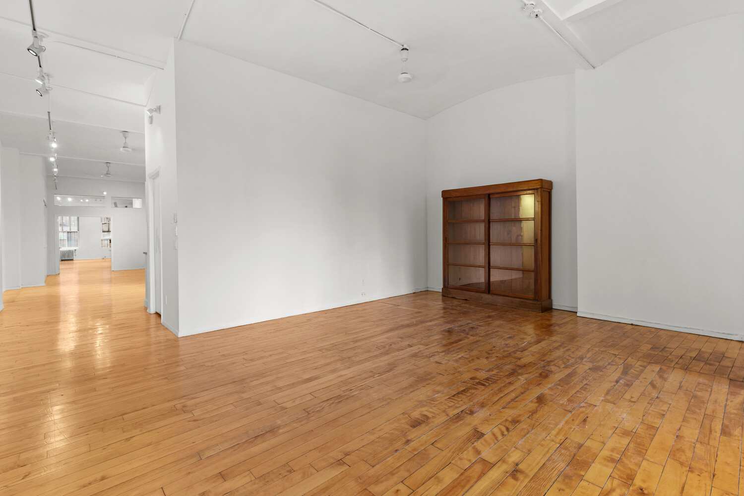 712 Broadway, Unit 7 Manhattan, NY 10003 - Photo 6 of 14 a view of empty room with wooden floor
