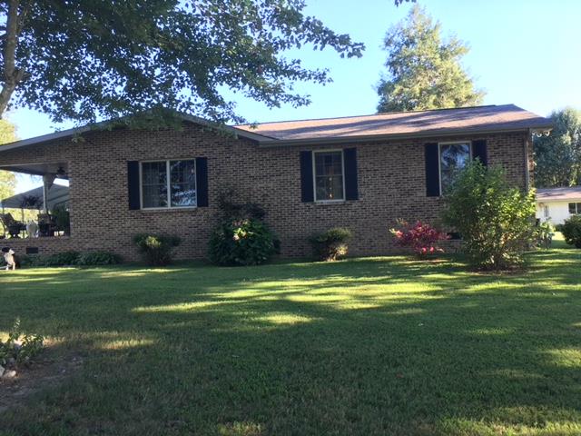 826 Wayside Road Manchester, TN 37355 - Photo 1 of 31 a front view of a house with a garden