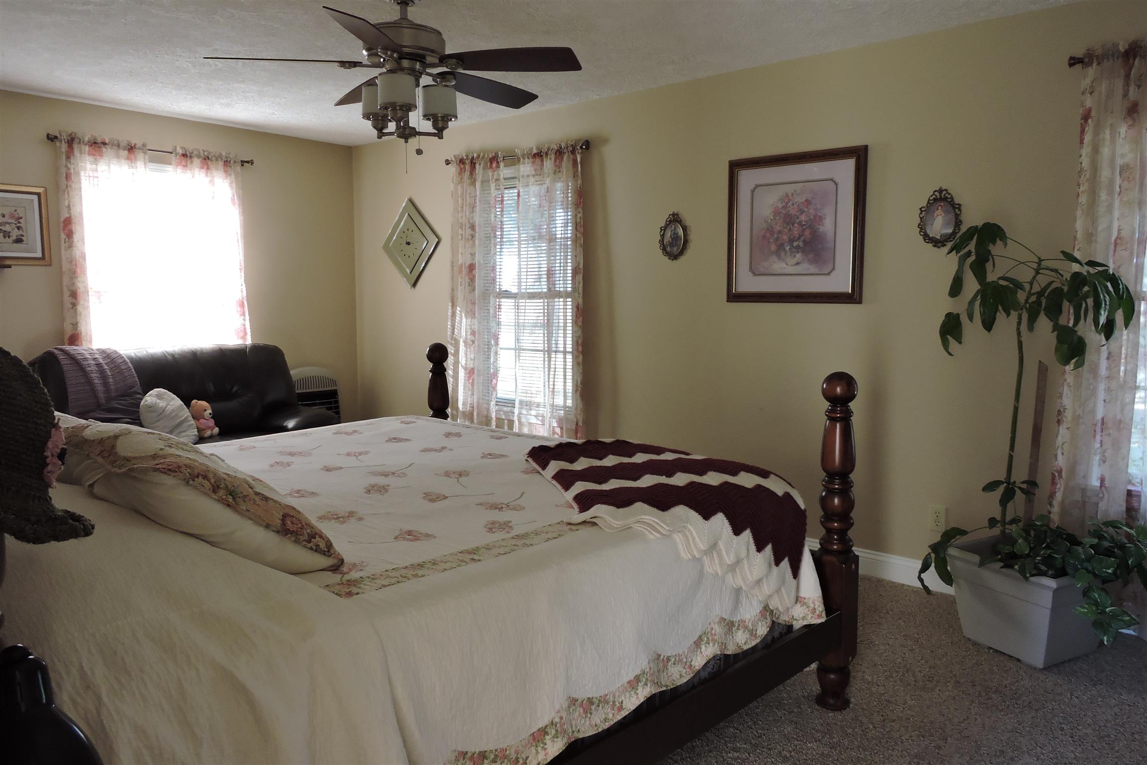826 Wayside Road Manchester, TN 37355 - Photo 15 of 31 a bedroom with a bed and a chandelier