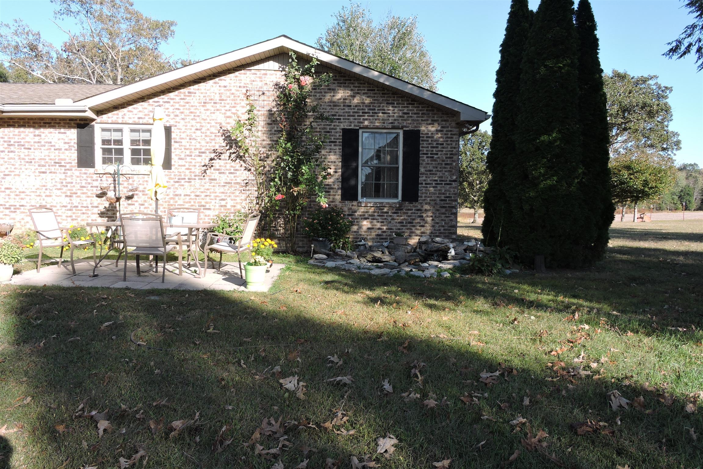 826 Wayside Road Manchester, TN 37355 - Photo 20 of 31 a view of a house with backyard and garden