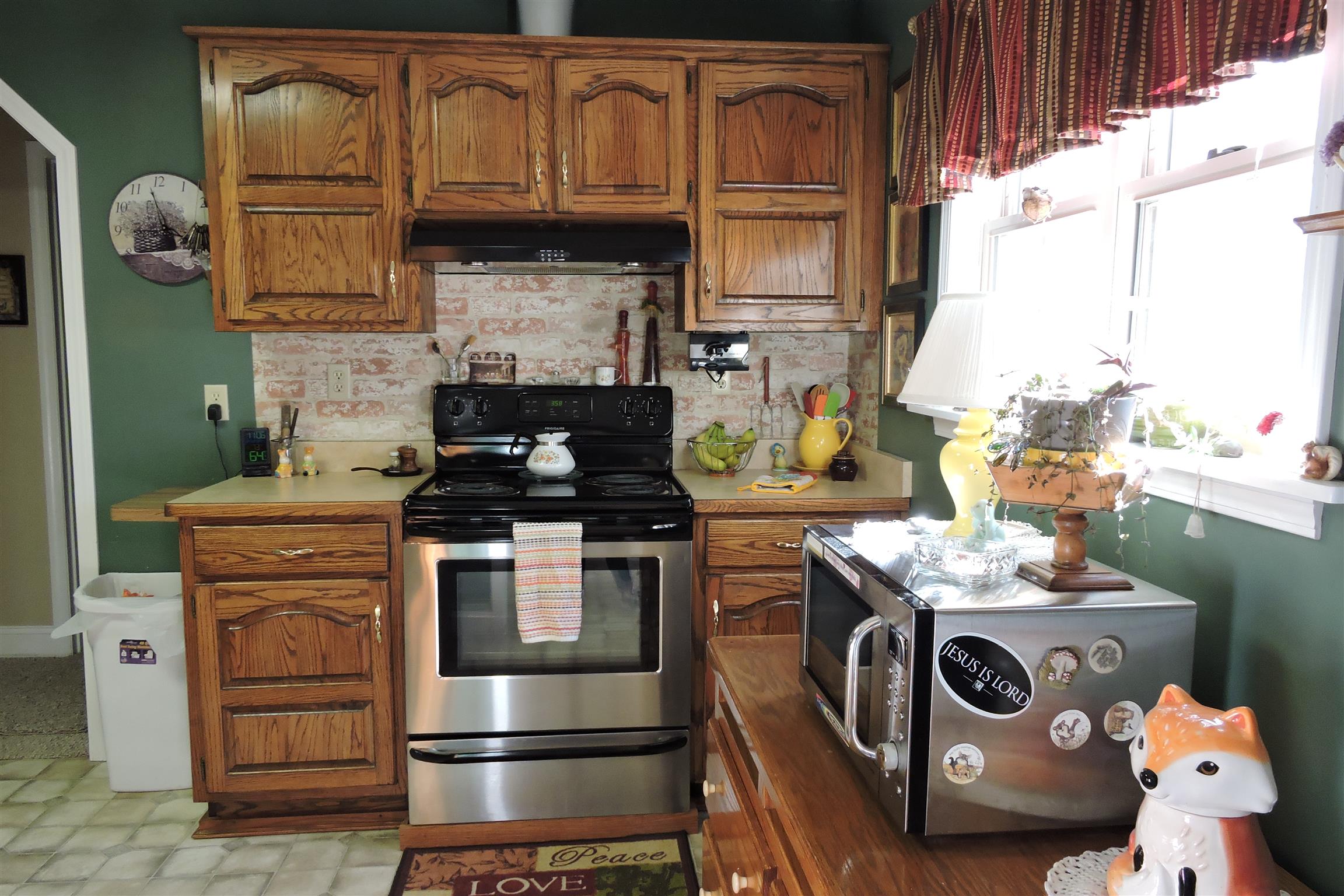 826 Wayside Road Manchester, TN 37355 - Photo 8 of 31 a kitchen with granite countertop a stove and a white wooden cabinets