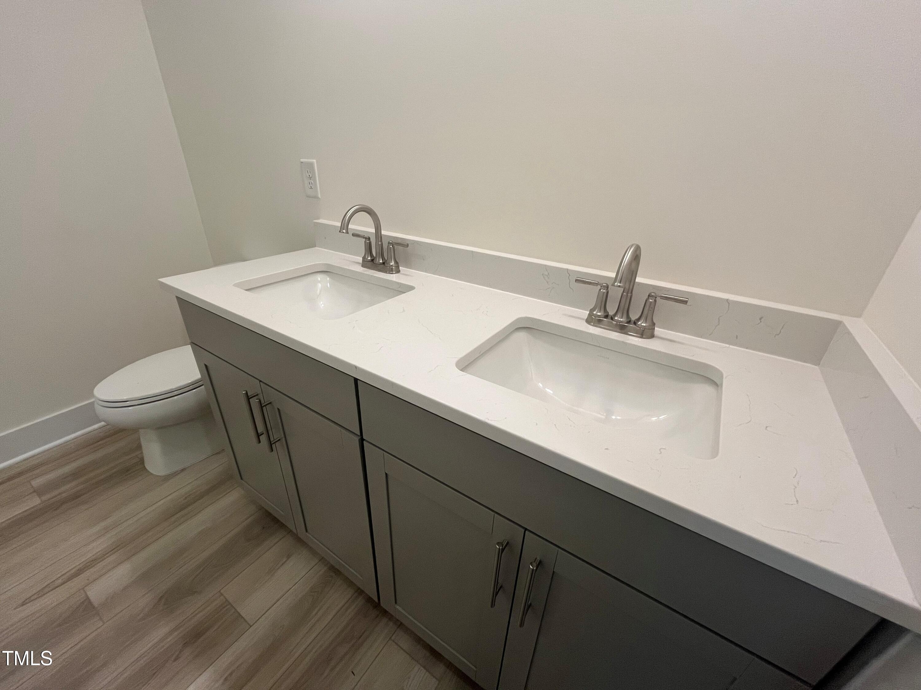 766 Old Station Pointe Angier, NC 27501 - Photo 20 of 40 a bathroom with a sink and a toilet