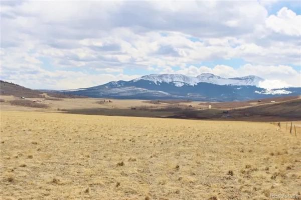 a view of an ocean beach and mountain