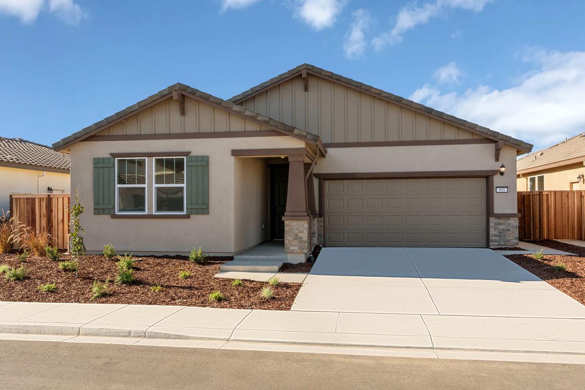 a front view of a house with garage