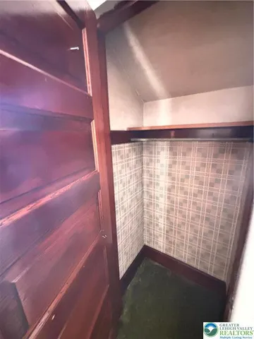 a bathroom with a tub and shower