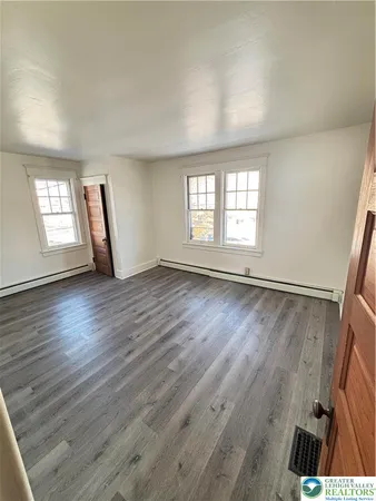 a view of a kitchen with a sink and cabinets