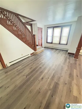 wooden floor in a hall with an entryway