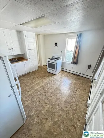 a view of a kitchen with microwave and stove