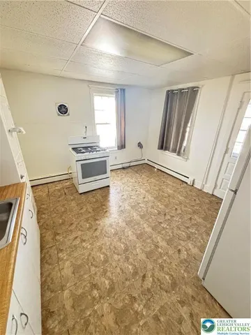 a room with a stove and a window