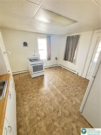 a room with a stove and a window