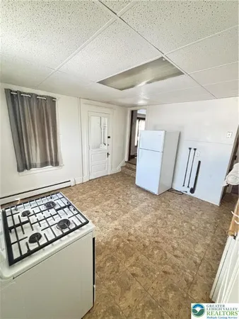 a kitchen that has a stove and a refrigerator