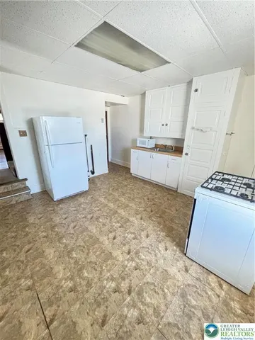 a view of a kitchen with a sink