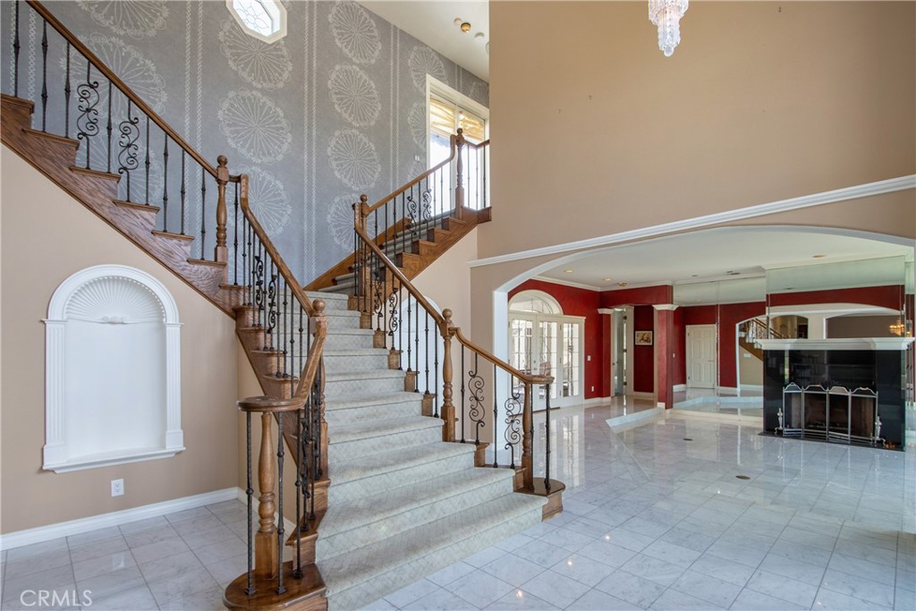 46856 El Prado Road Temecula, CA 92590 - Photo 18 of 75 a view of entryway and hall with dining room and stairs