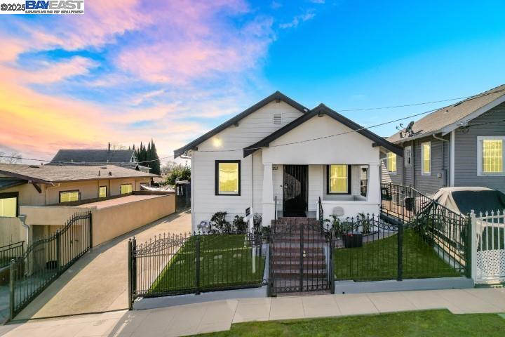 4211 Santa Rita Street Oakland, CA 94601 - Photo 1 of 1 a front view of house with yard and green space