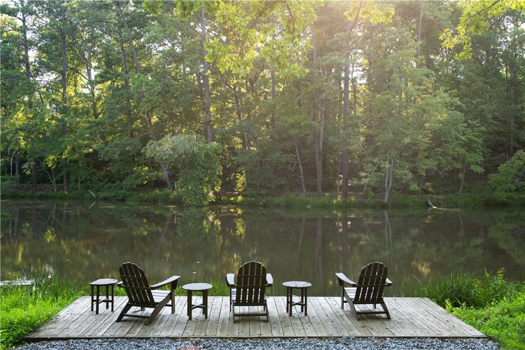 13565 Wood Fern Way Roswell, GA 30075 - Photo 11 of 14 a view of a lake from a yard