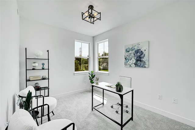 a view of a livingroom with furniture and window