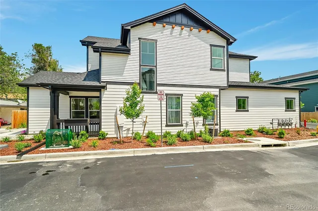 a front view of a house with a outdoor space