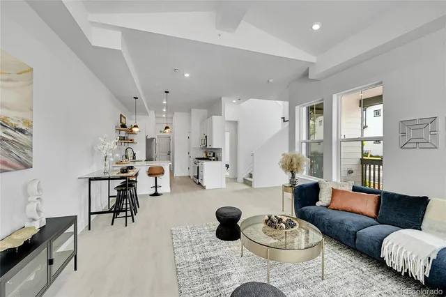 a living room with furniture and a rug