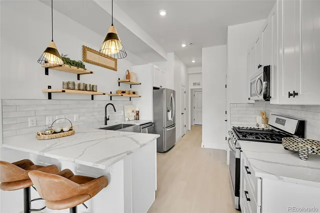 a kitchen with sink and stove