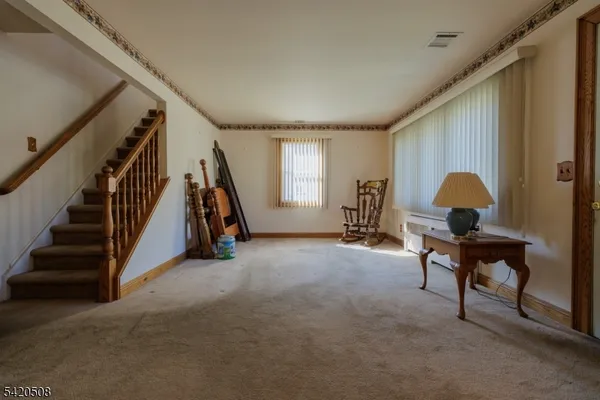a view of game room with windows