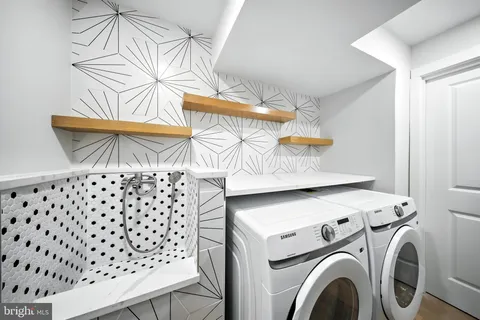 a utility room with dryer and washer