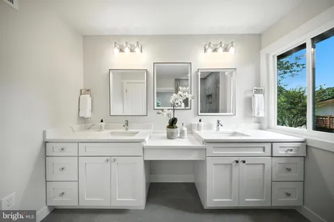 a bathroom with a tub sink and shower