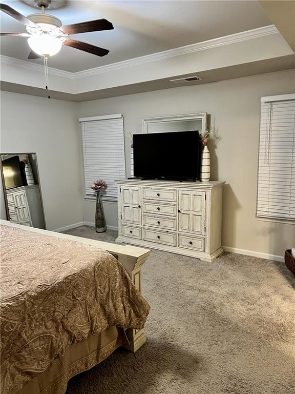 270 Wellbrook Drive Covington, GA 30016 - Photo 8 of 11 a bedroom with a bed and a flat screen tv