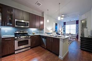 a kitchen with a sink stove and microwave
