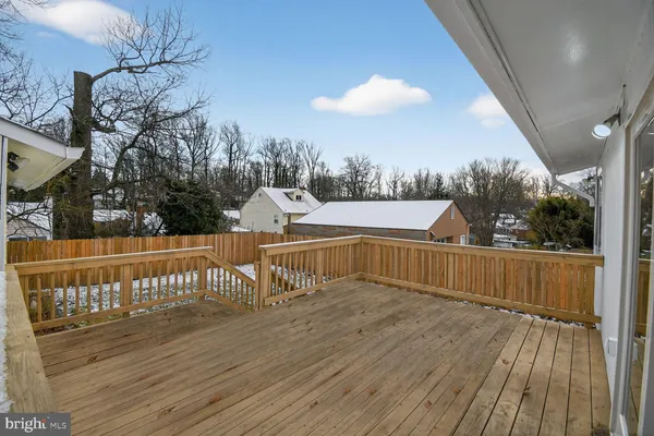 a view of a balcony with wooden floor