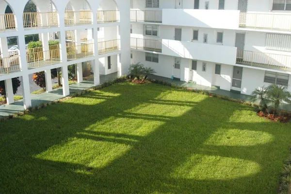 a view of building with a yard